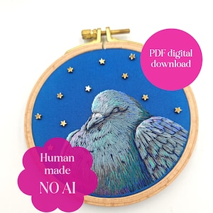 May include: An embroidery hoop containing blue fabric with a stitched pigeon featuring iridescent plumage. Small gold star-shaped embellishments are scattered across the fabric. The text reads PDF digital download and Human made NO AI.