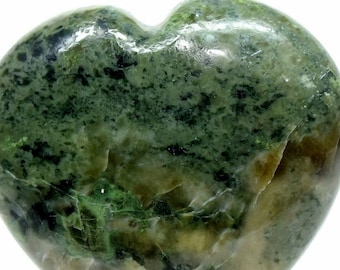 May include: A green and brown heart-shaped stone with a polished finish. The stone has a mottled appearance with swirls of green and brown.