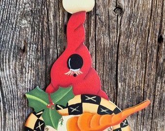 Red hat peeking snowman