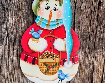 Snowlady with a birdseed basket