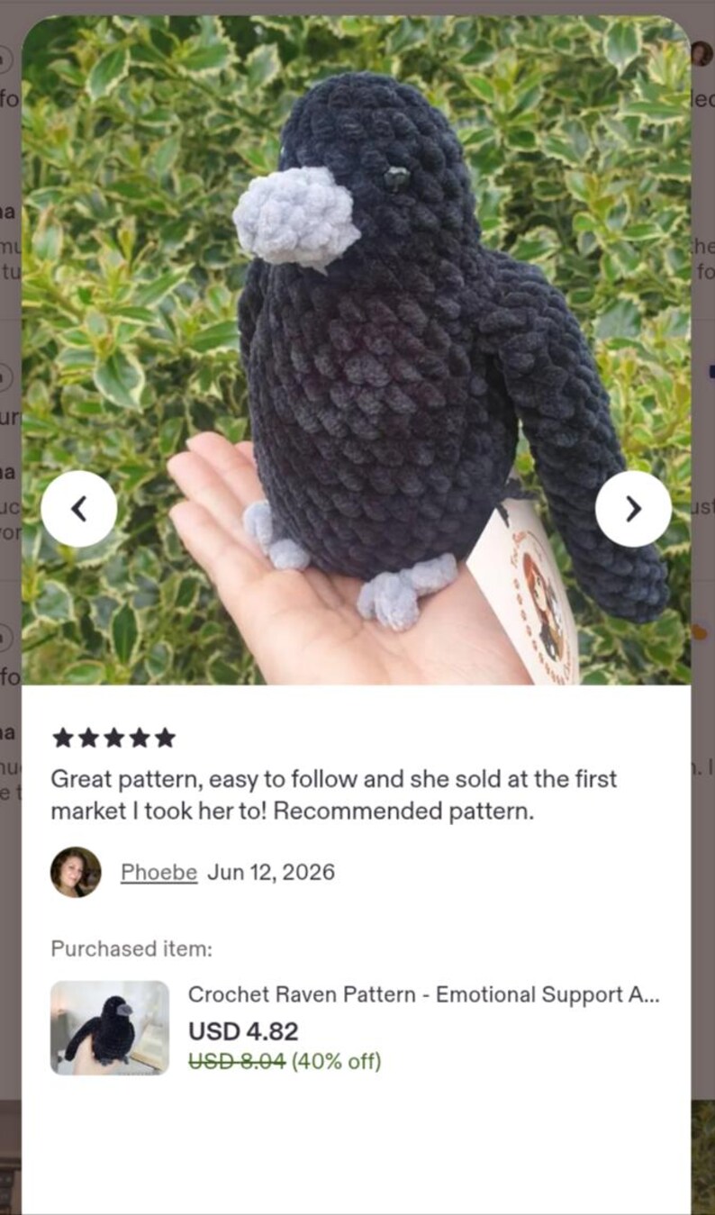 May include: A handmade crochet raven plush toy crafted from dark black yarn with a textured, fuzzy appearance. The bird features a light grey beak and matching light grey feet, with small black bead eyes and a white paper tag attached to its side.