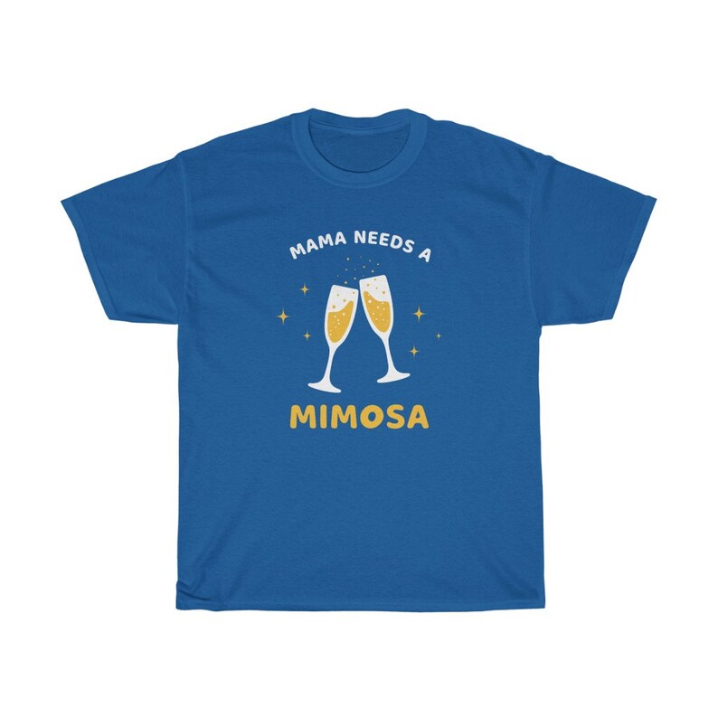 May include: Royal blue t-shirt with the text "MAMA NEEDS A MIMOSA" in white and yellow. The design features two champagne flutes clinking together, with star accents. A casual, comfortable tee.