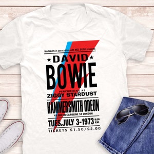 Camicia Bowie Hammersmith 1973, Poster di David Bowie Hammersmith 1973, T-shirt David Bowie, T-shirt rock, T-shirt musica rock, T-shirt Rebel Rebel