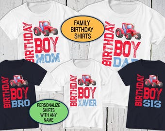 May include: A collection of five t-shirts featuring a red tractor graphic and the text Birthday Boy. The shirts include labels for Mom, Dad, Bro, Sis, and the name Xavier. The shirts are white or dark blue with red and blue lettering.