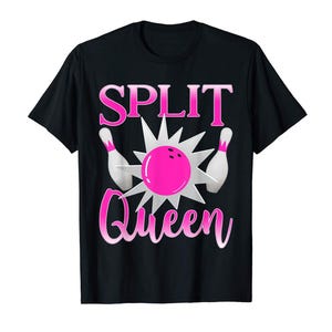 May include: A black short-sleeved t-shirt featuring a graphic print of a pink bowling ball hitting two white bowling pins with a silver starburst effect. The text SPLIT QUEEN is printed in a pink gradient font above and below the graphic.