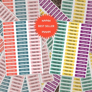 May include: A set of colorful rectangular name labels with the name "Mesick Adin" printed on each label. The labels are in various colors, including pink, teal, yellow, and purple.