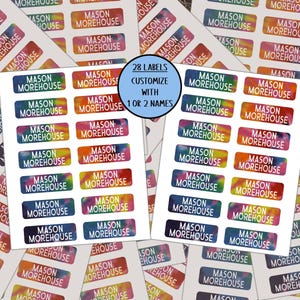 May include: A collection of rectangular adhesive labels featuring a vibrant, multi-colored tie-dye background with the white text MASON MOREHOUSE printed on each. A central circular graphic states 28 LABELS CUSTOMIZE WITH 1 OR 2 NAMES.