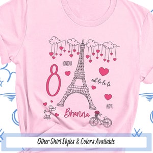 a pink shirt with the eiffel tower on it