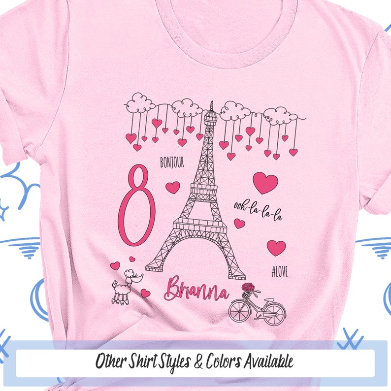 a pink shirt with the eiffel tower on it
