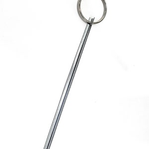 May include: A silver metal key chain with a long, thin, straight metal rod attached to a silver metal ring.