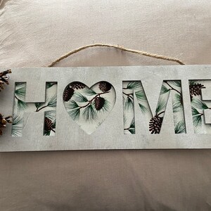 Silver &quot;Home&quot; Sign with Pinecone Accent Fabric and Pinecones