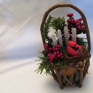 Grape Vine Basket With Terra Cotta Clay Pot, Holiday Filled Basket, Round Basket Filled With Pine, Berries, Cardinal, Bird Nest, Fence Piece