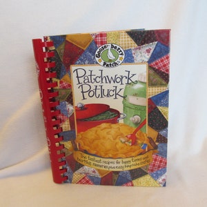 May include: A red spiral bound cookbook with a patchwork quilt design on the cover. The title is "Patchwork Potluck" with a gooseberry patch logo. The text reads "The tastiest recipes for happy times and heartfelt memories plus easy keepsake crafts."