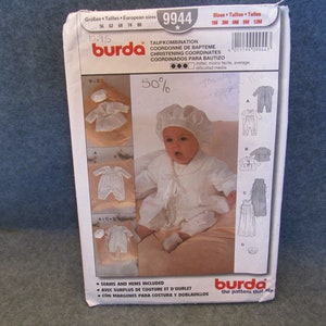 May include: Burda sewing pattern 9944 for a baby christening outfit. The pattern includes a bonnet, a long-sleeved gown, a romper, and a jacket. The pattern is for sizes 1 month, 3 months, 6 months, and 12 months.
