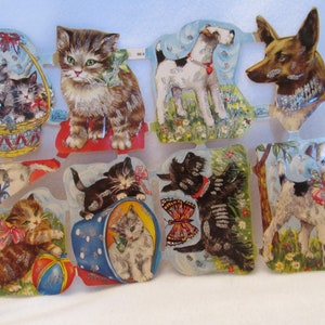 May include: A set of vintage paper cutouts featuring kittens and puppies. The cutouts are decorated with glitter and have a whimsical, cartoonish style. The cutouts are perfect for scrapbooking, card making, or other craft projects.