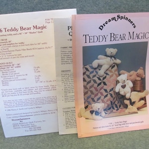 May include: A pink and white pamphlet with the title "Dream Spinners Teddy Bear Magic" and a picture of a teddy bear quilt. The pamphlet includes instructions for making a 20-inch beanbag teddy bear and a 46-inch by 58-inch quilt.