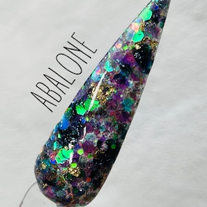 May include: Abalone nail polish with iridescent green, purple, and gold glitter.
