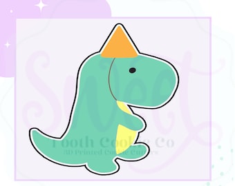May include: A green dinosaur cookie cutter with a yellow party hat. The cutter is wearing a yellow party hat and has a black outline. The text "Tooth Cookie Co. 3D Printed Cookie Cutters" is at the bottom of the image.