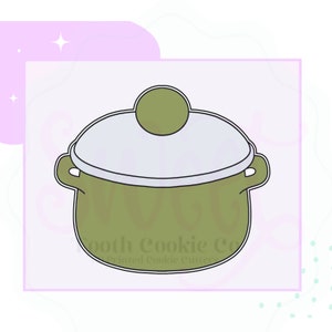 May include: Green ceramic pot with a white lid and a knob on top. The pot has two handles on the sides. The pot is a cookie cutter.