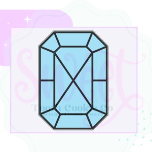 May include: A light blue, geometric gem-shaped cookie cutter with black outlines. The cutter has a rectangular shape with angled edges and internal lines. The background is a soft lavender color with decorative elements and the text "Them Cooki Co".