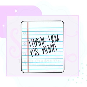 May include: A white sheet of paper with blue lines and red margins. The paper has the text "THANK YOU MS. JANIA" written on it.