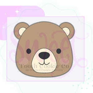 May include: A brown bear face cookie cutter with black eyes and a black nose. The cookie cutter has a smiling mouth and the text "Tooth Cookie Co 3D Printed Cookie Cutters". The bear has light brown inner ears.