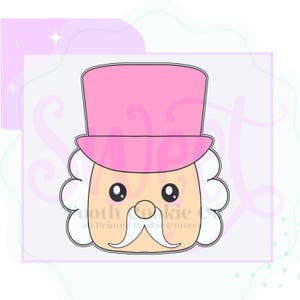 May include: A pink and white cookie cutter in the shape of a cartoon character with a pink hat, white beard, and a mustache. The character has large eyes and a small nose.