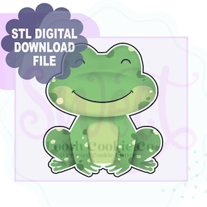 May include: A digital download file for a 3D printed cookie cutter in the shape of a green frog with a smiling face. The frog is sitting with its legs crossed.