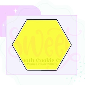 May include: A yellow hexagon cookie cutter with the word "sweet" written inside. The cutter is on a light purple background with white polka dots.