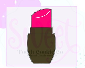 May include: A black and pink lipstick cookie cutter. The cutter is shaped like a lipstick tube with a pink top and a black base.