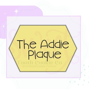 May include: A yellow hexagon-shaped cookie cutter with the text "The Addie Plaque" in black. The words "Tooth Cookie Co" and "3D Printed Cookie Cutters" are below the main text. The background is light purple with decorative elements.