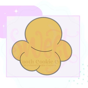 May include: A 3D printed cookie cutter shaped like a popcorn kernel. The cutter is outlined in black and filled with a light yellow color.
