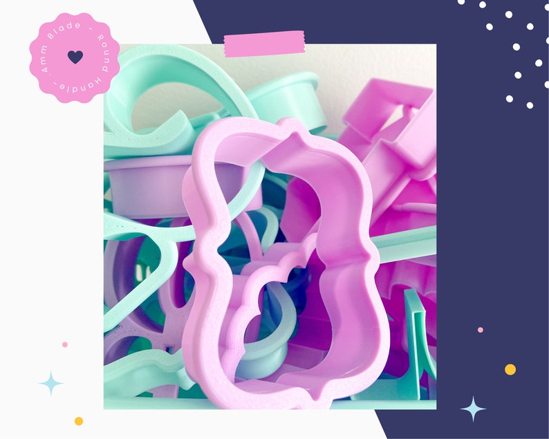 May include: A collection of pastel-colored plastic cookie cutters in various shapes, including a large, ornate, pink, curly design.