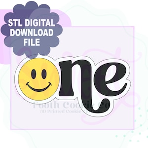 May include: A black and yellow 3D printed cookie cutter shaped like the word "one" with a smiley face to the left of the word.