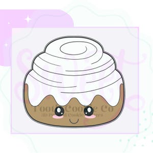 May include: A cartoon cinnamon roll cookie cutter with a white icing swirl and brown bottom. The cookie cutter has a smiling face with two large black eyes and pink cheeks.