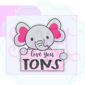 May include: A gray elephant with pink ears holds a pink sign that says "love you tons".