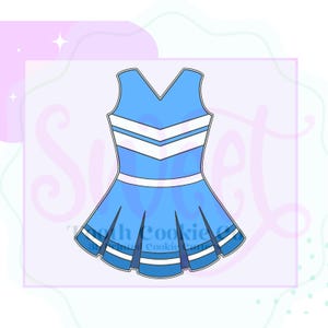 May include: A light blue cheerleader dress cookie cutter with white stripes and a pleated skirt. The dress has a V-neck and is outlined in black. The text "Tooth Cookie Co." is visible in the bottom center.