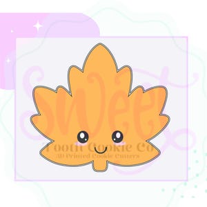 May include: An orange maple leaf cookie cutter with a cute face, black eyes, and a smiling mouth. The text "Sweet Tooth Cookie Co" and "3D Printed Cookie Cutters" are printed below the leaf.