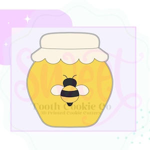 May include: A yellow honey jar cookie cutter with a white lid and a black and yellow bee. The text "Tooth Cookie Co" and "3D Printed Cookie Cutters" are printed on the jar. The design is on a light purple background.