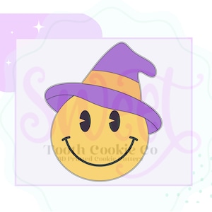 May include: A yellow smiley face cookie cutter with a purple witch hat. The hat has a black brim and a yellow band.