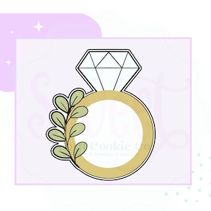 May include: A gold ring with a diamond on top and a green leafy branch on the side. The ring is outlined in black.