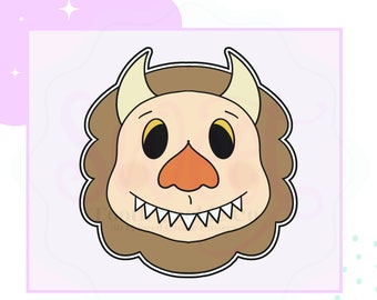 May include: A brown and white cartoon monster with a toothy grin, large eyes, and a small orange nose. The monster has two horns and a fluffy mane.