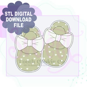 May include: A digital download file for a 3D printed cookie cutter in the shape of two baby shoes with bows and a heart pattern. The file is for STL digital download.