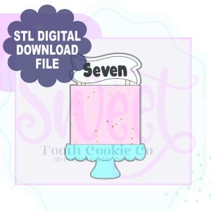 May include: A pink and white cake with gold sprinkles and a banner that says "Seven" on top. The cake is on a blue cake stand. This is a digital download file for a 3D printed cookie cutter.