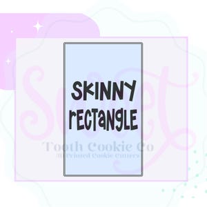 May include: A light blue rectangular cookie cutter with the words "SKINNY RECTANGLE" in black. The cookie cutter is from Tooth Cookie Co.