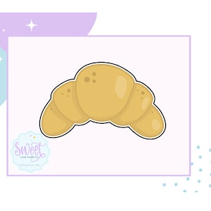 May include: A yellow cartoon croissant cookie cutter. The cookie cutter is shaped like a crescent roll with a brown outline.