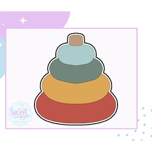 May include: A stackable toy with four rings in red, orange, green, and blue colors. The toy is made of wood and has a brown top.