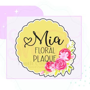 May include: A yellow circle with a scalloped edge, featuring the text "Mia Floral Plaque" and a floral design with pink and red roses, green leaves, and white flowers.