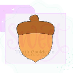 May include: A brown and orange acorn cookie cutter. The cutter is shaped like an acorn with a cap on top.