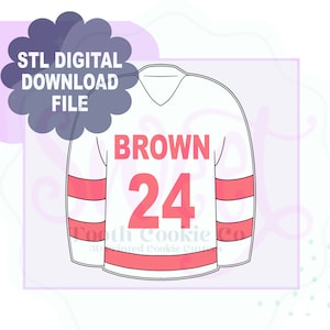 May include: White hockey jersey with red and white stripes on the sleeves. The jersey has the name "BROWN" and the number "24" printed on the front in red.